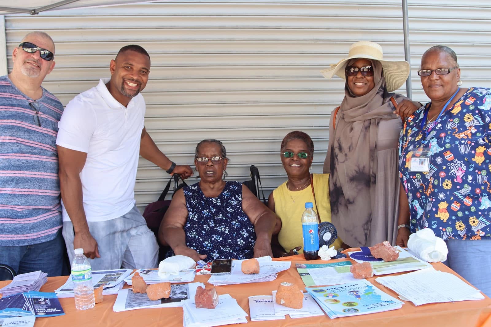 Doris “Jean” Hackney with Grands As Parents members and community partners at an outreach table
